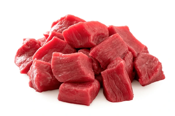 Meat delivery Dubai: Fresh, tender raw meat cuts on a wooden board, ready for cooking, with herbs and spices on the side."