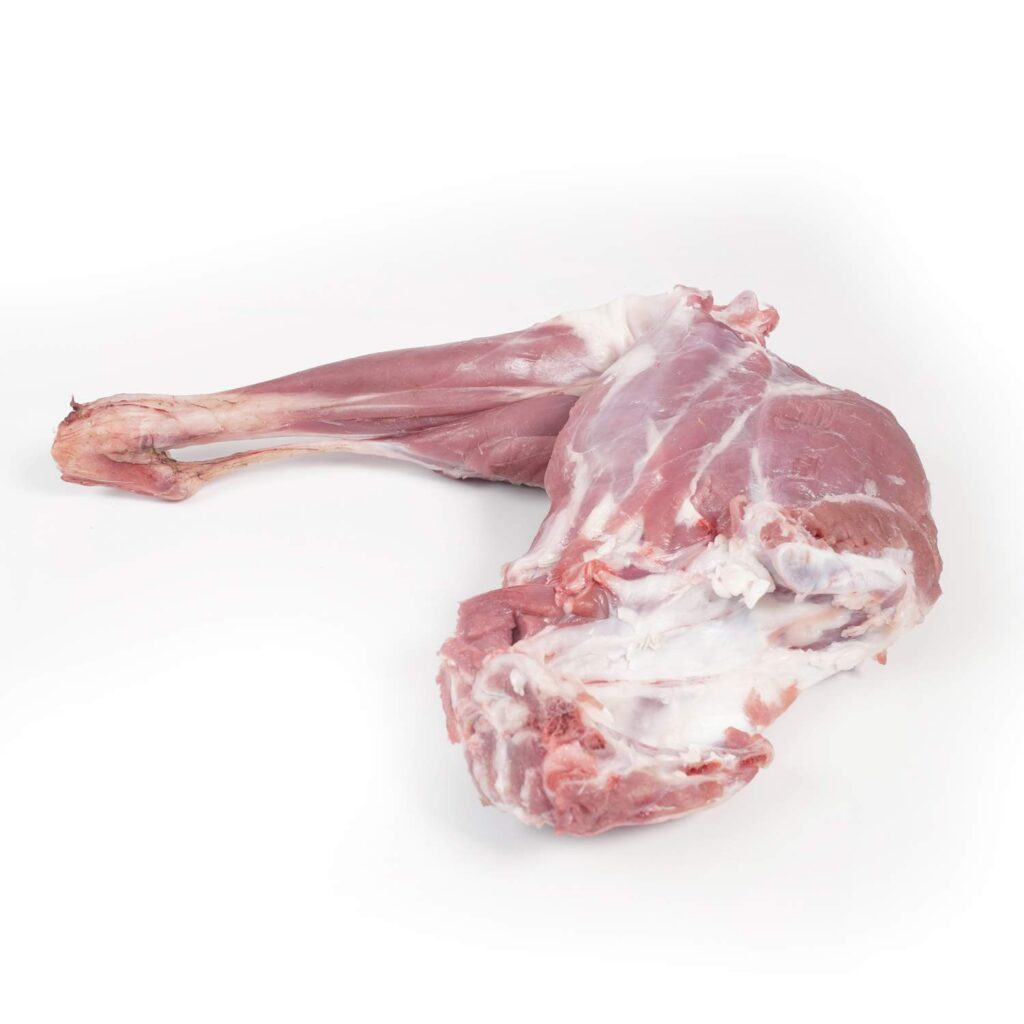 Meat delivery Dubai: Fresh, tender raw meat cuts on a wooden board, ready for cooking, with herbs and spices on the side.