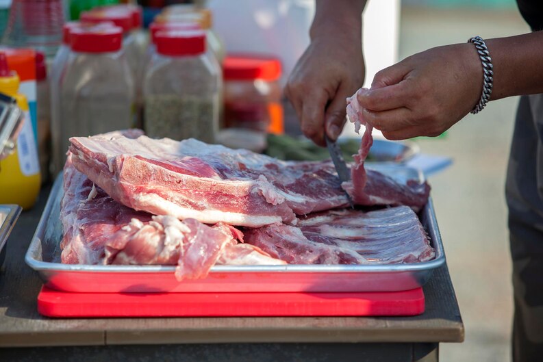Fresh pork cuts neatly displayed in a chilled section at a Dubai pork shop, ready for delivery.