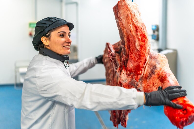 A variety of premium frozen meat cuts displayed on a wooden board, provided by trusted frozen meat suppliers in Dubai
