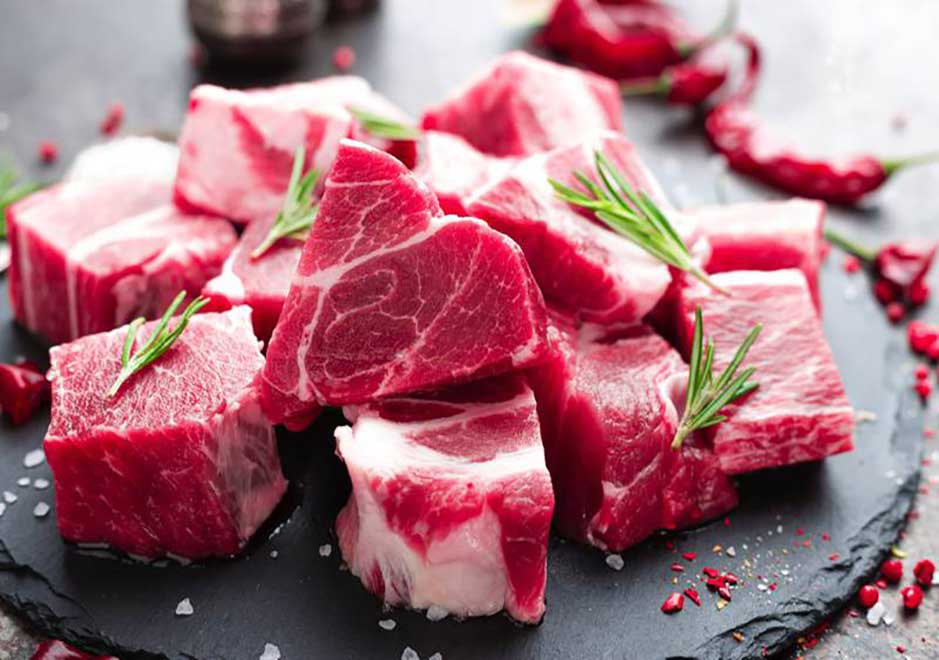 Skilled butcher preparing high-quality cuts in Dubai’s top meat supplier facility